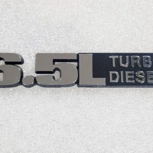 Close-up of a 6.5L Turbo Diesel emblem.