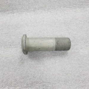 A metal bolt with a round head and partially threaded shaft on a textured surface.